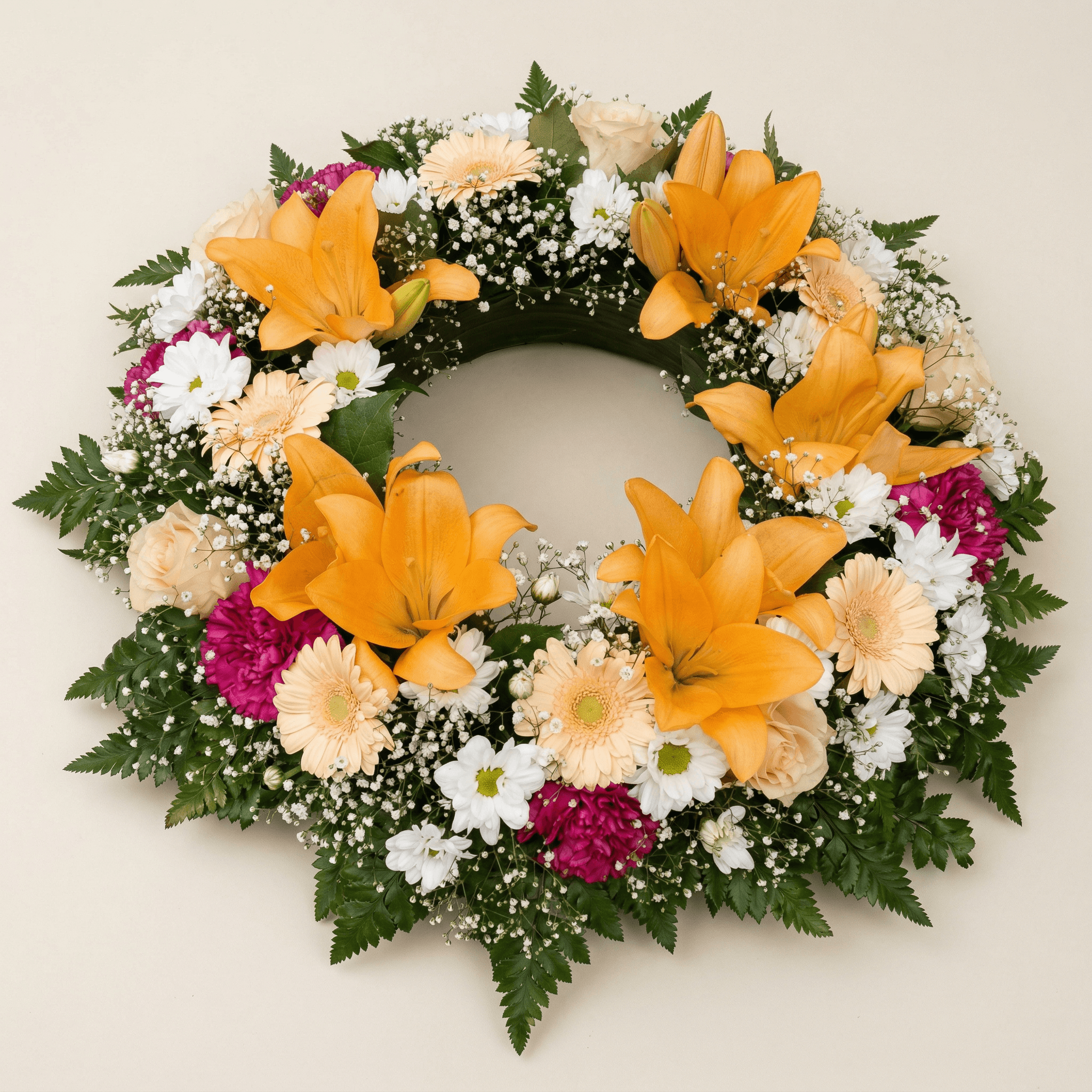 Krans med orange liljor och brudslöja